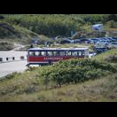 Der Sandormen (Sandwurm), der Touristen an die Landspitze von Grenen bringt